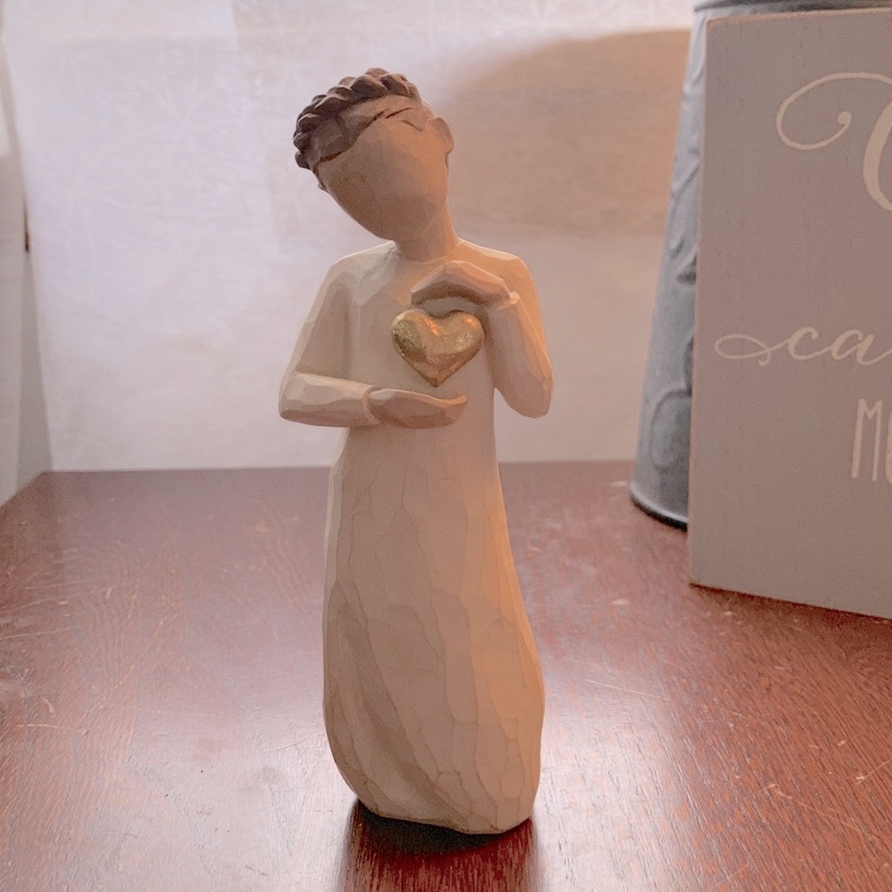 Willow tree girl holding a heart